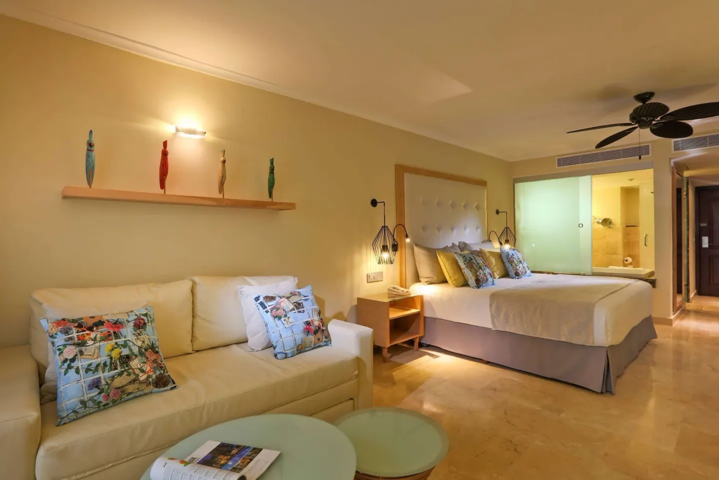Junior Suite Garden View with sofa and king bed at Grand Palladium Palace Resort Spa & Casino.
