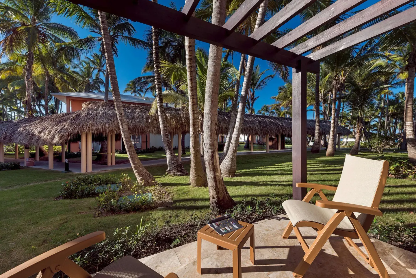 Garden terrace seating outside a Junior Suite at Grand Palladium Palace Resort Spa & Casino.