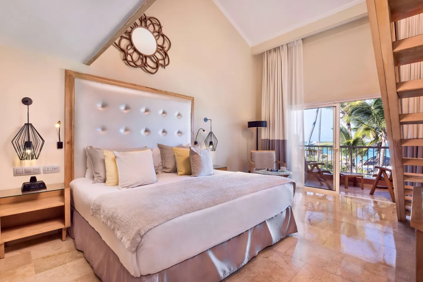 Loft Suite Beachside Panoramic OV bedroom with king bed at Grand Palladium Palace Resort Spa & Casino.