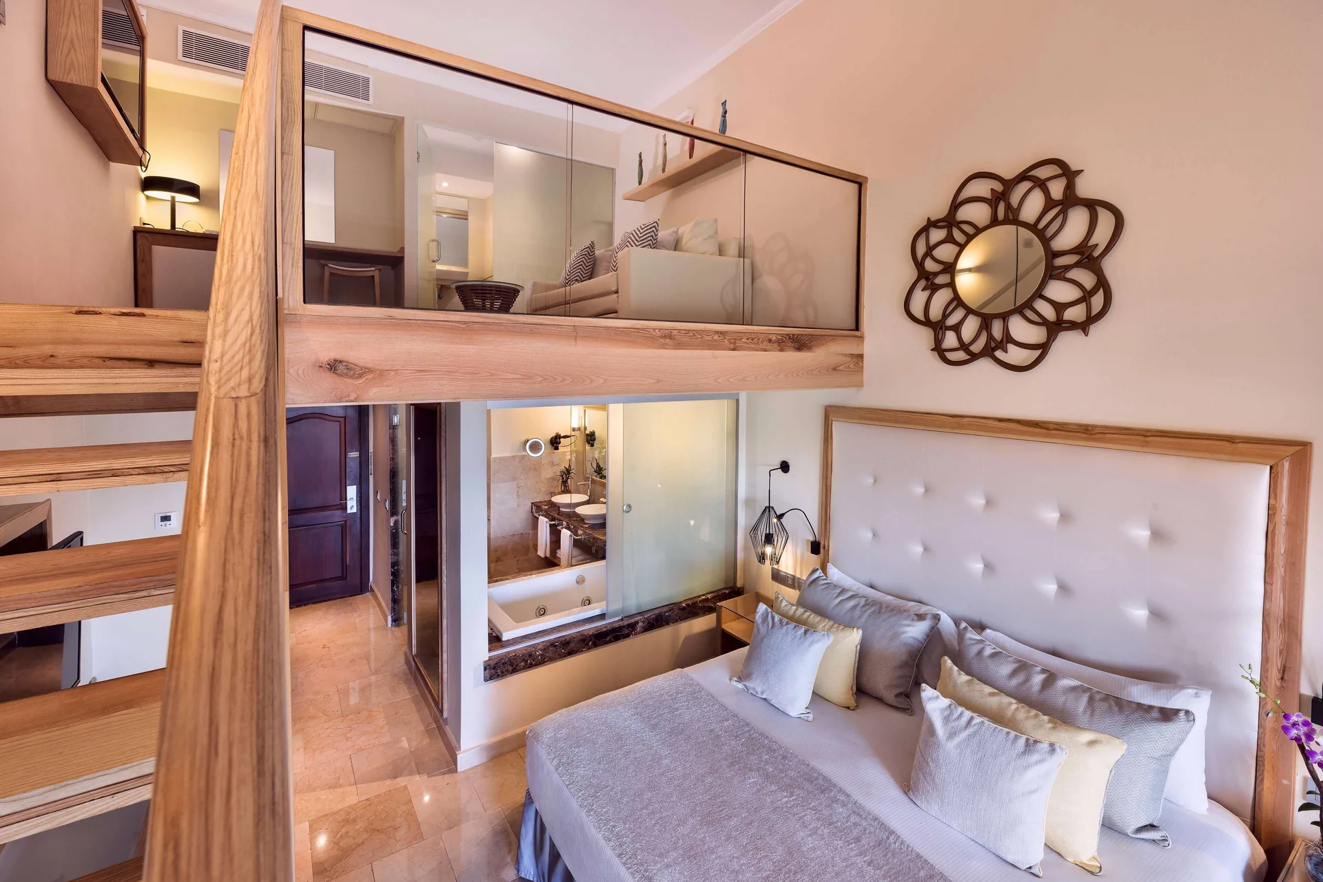 Loft Suite Garden View bedroom and mezzanine at Grand Palladium Palace Resort Spa & Casino.