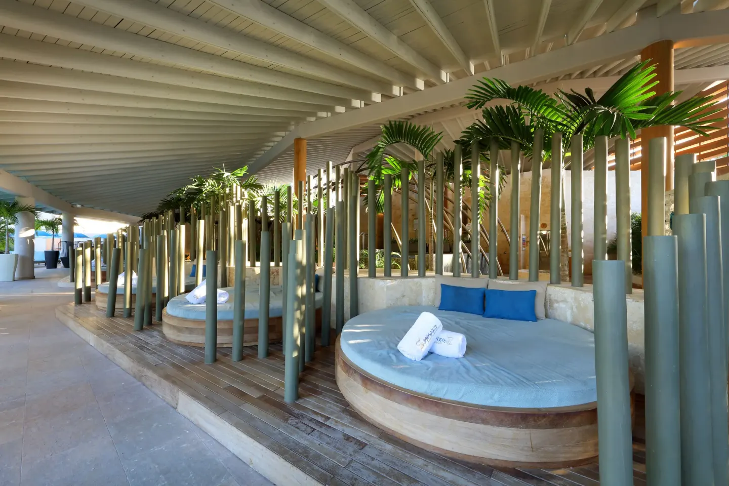 Covered lounge area with round daybeds at Grand Palladium Punta Cana Resort & Spa.