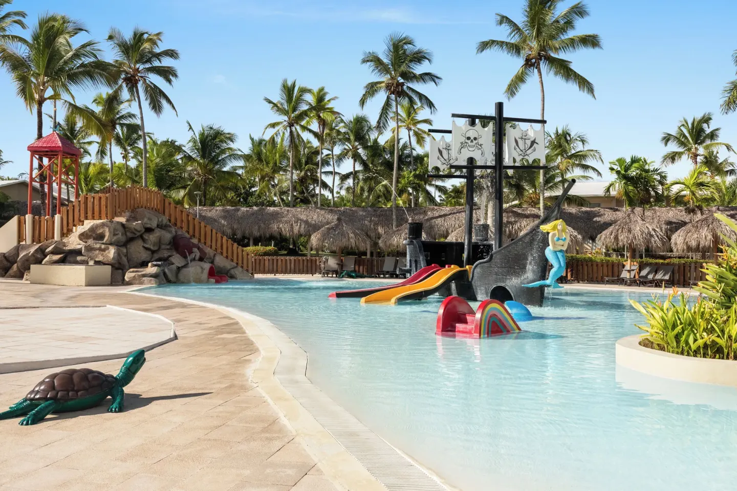 Kids’ pool with pirate ship and play bridge at Grand Palladium Punta Cana Resort & Spa.