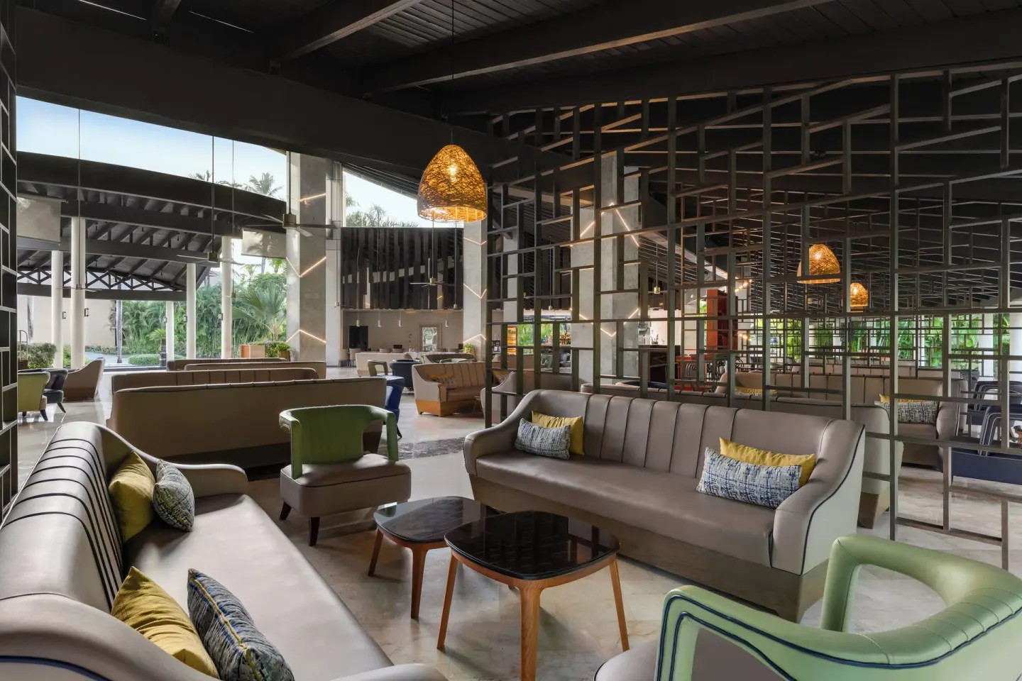 Lobby lounge seating with sofas and open partitions at Grand Palladium Punta Cana Resort & Spa.