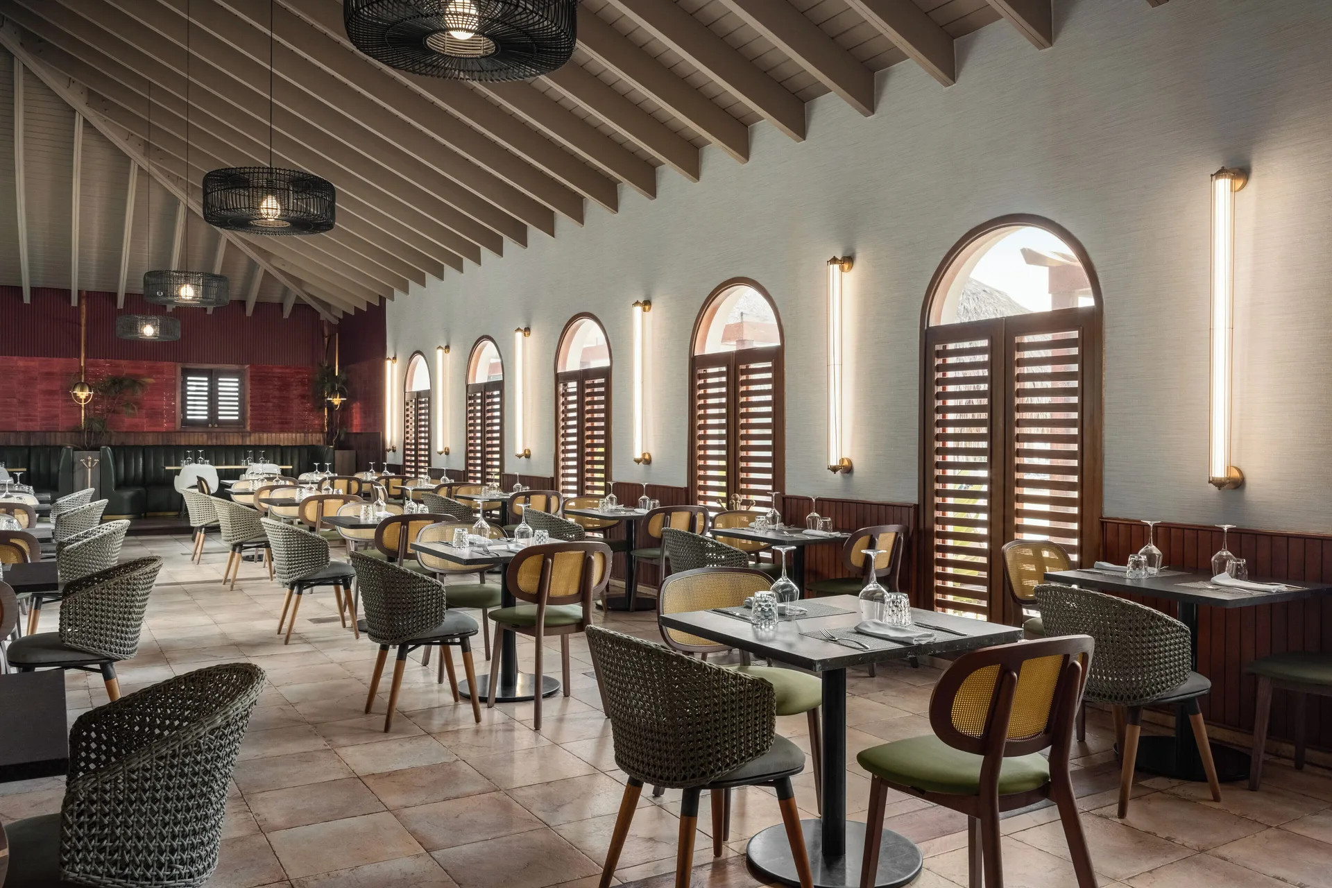 Restaurant dining room with arched windows at Grand Palladium Punta Cana Resort & Spa.
