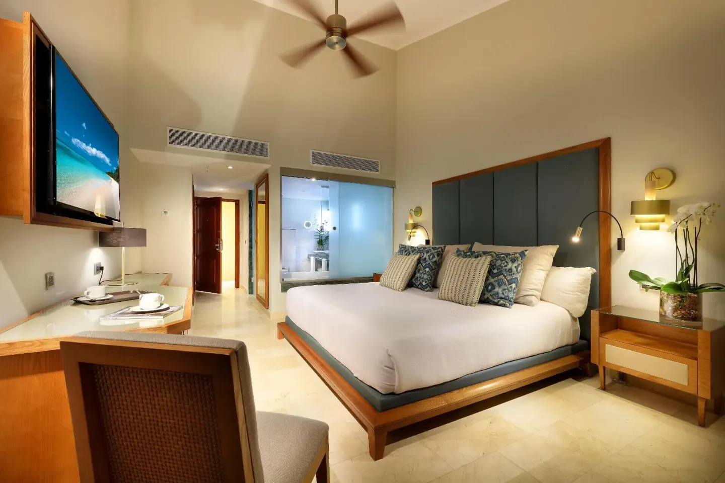 Deluxe Garden View Room with king bed and desk at Grand Palladium Punta Cana Resort & Spa.