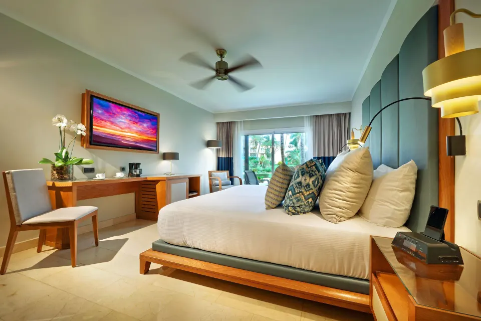 Deluxe Garden View room with king bed and patio at Grand Palladium Punta Cana Resort & Spa.