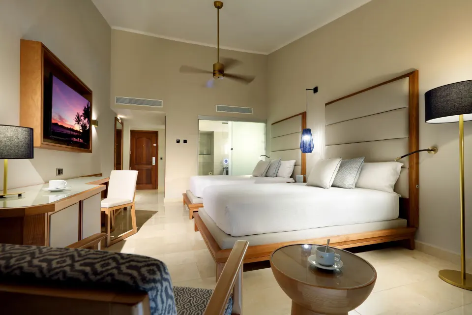 Deluxe Garden View room with two beds and desk at Grand Palladium Punta Cana Resort & Spa.