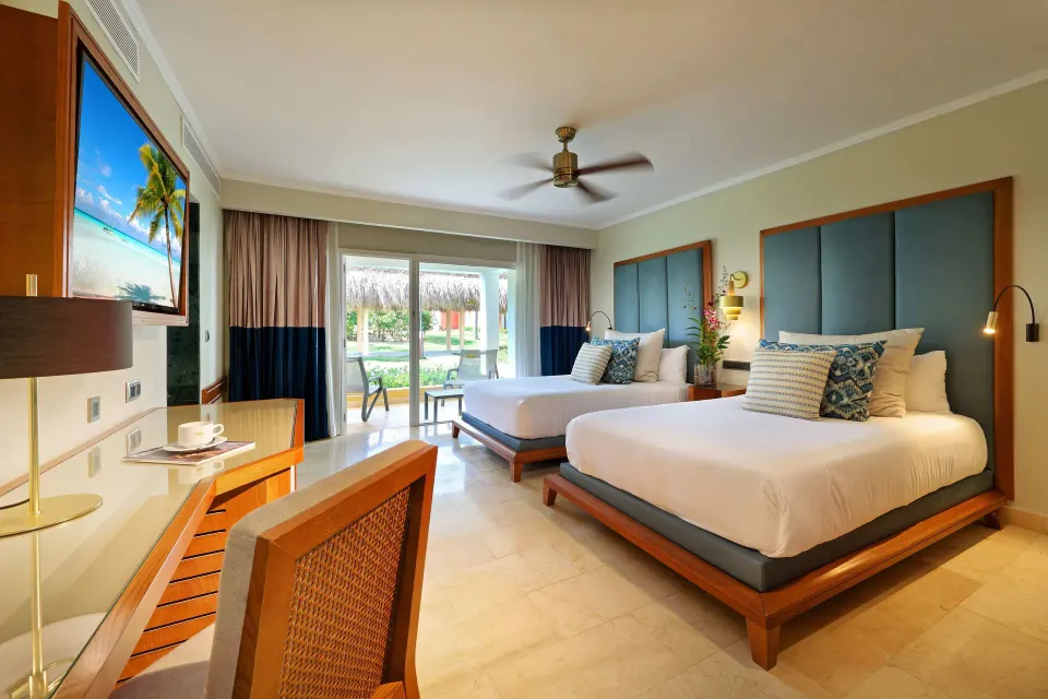 Deluxe Garden View room with two beds and patio doors at Grand Palladium Punta Cana Resort & Spa.