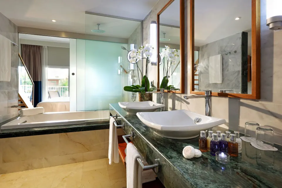 Loft Suite Garden View bathroom with twin sinks at Grand Palladium Punta Cana Resort & Spa.