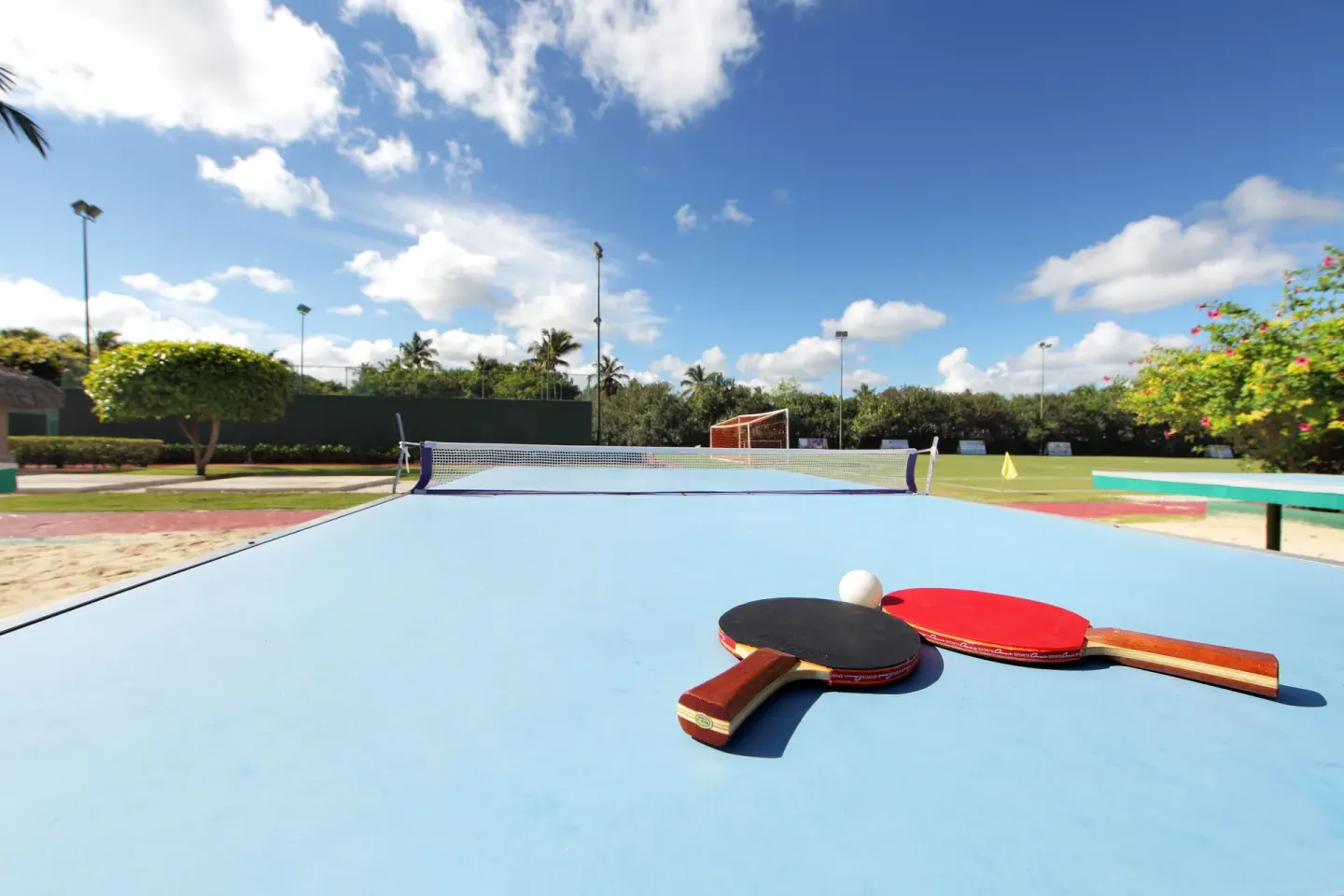 Table tennis setup beside outdoor courts at Grand Palladium Select Bávaro.