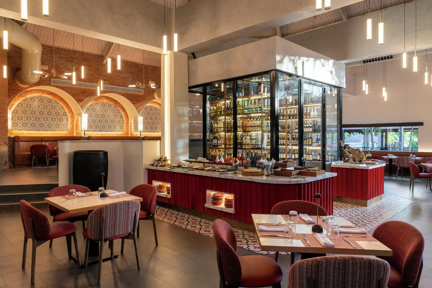 Spanish-style restaurant with glass wine display at Grand Palladium Select Bávaro.