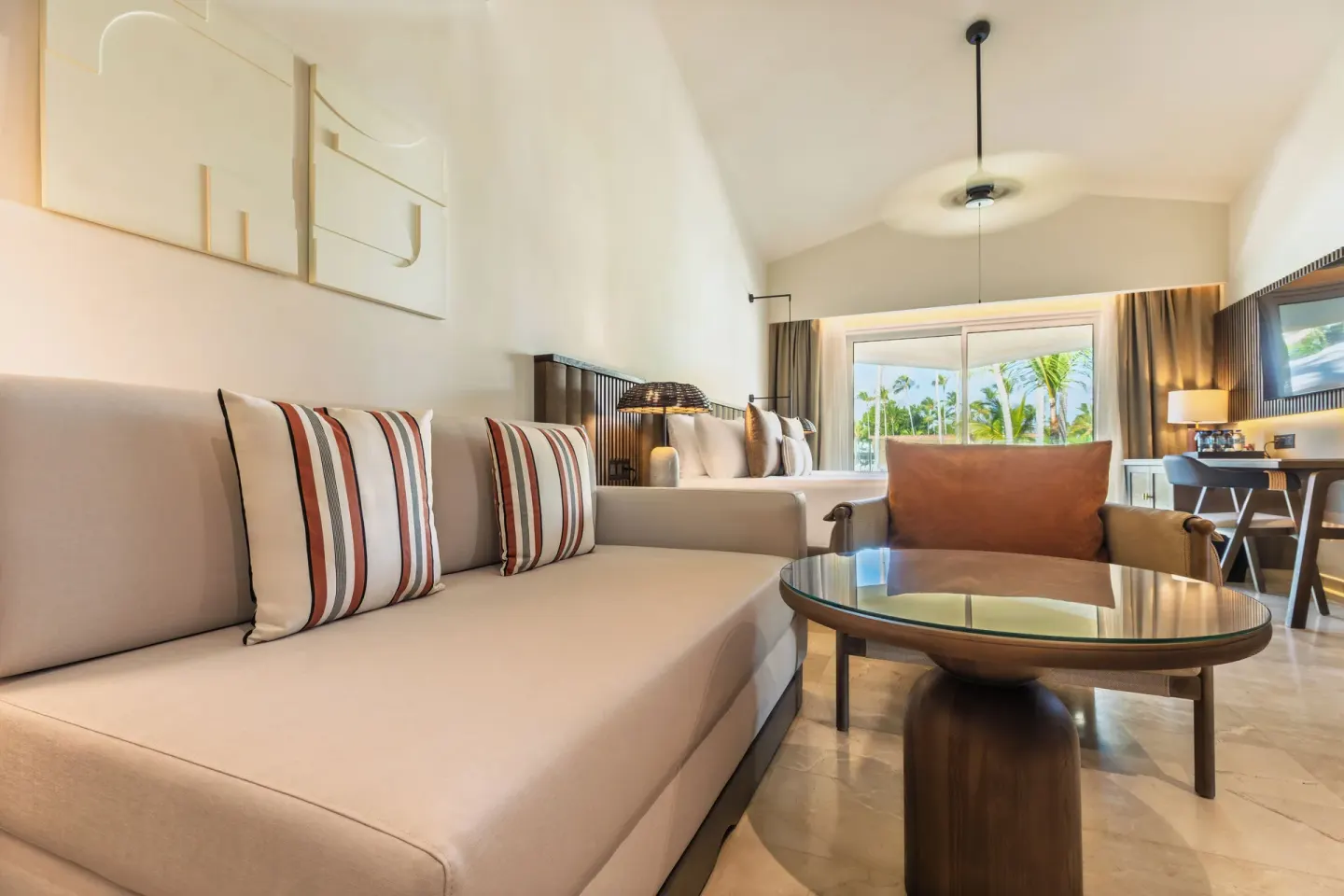 Family Selection Junior Suite Garden View sitting area at Grand Palladium Select Bávaro.