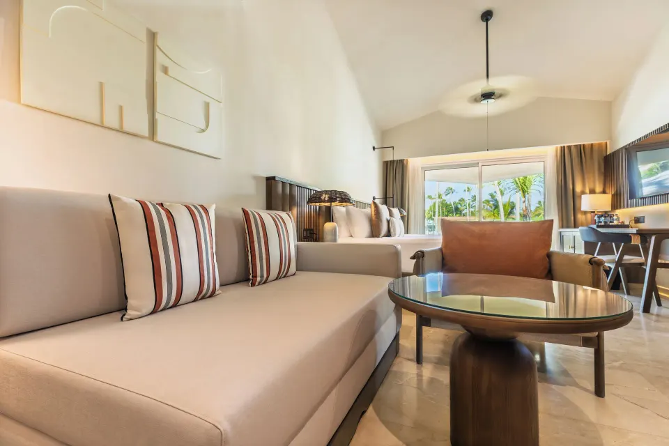 Family Selection Junior Suite Garden View sitting area at Grand Palladium Select Bávaro.