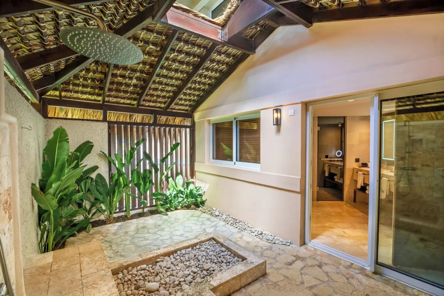 Romance Suite Garden View patio with rain shower at Grand Palladium Select Bávaro.