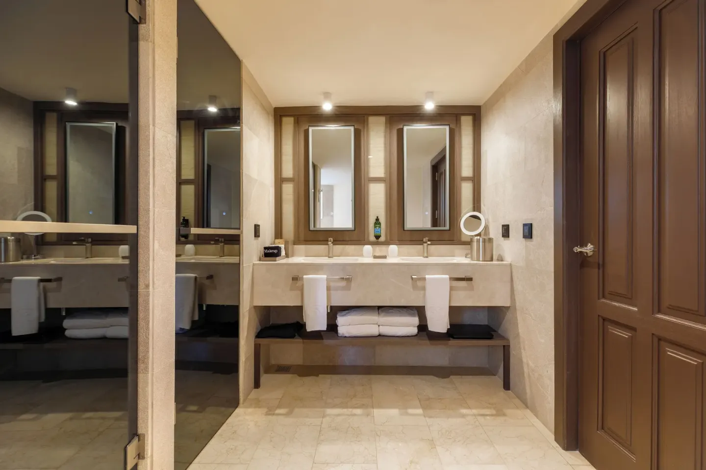 Superior Junior Suite Garden View bathroom at Grand Palladium Select Bávaro with twin sinks and glass shower.