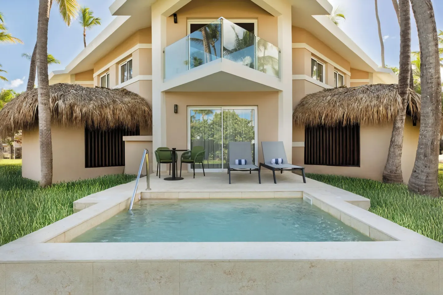 Superior Junior Suite private pool patio at Grand Palladium Select Bávaro with loungers and balcony.