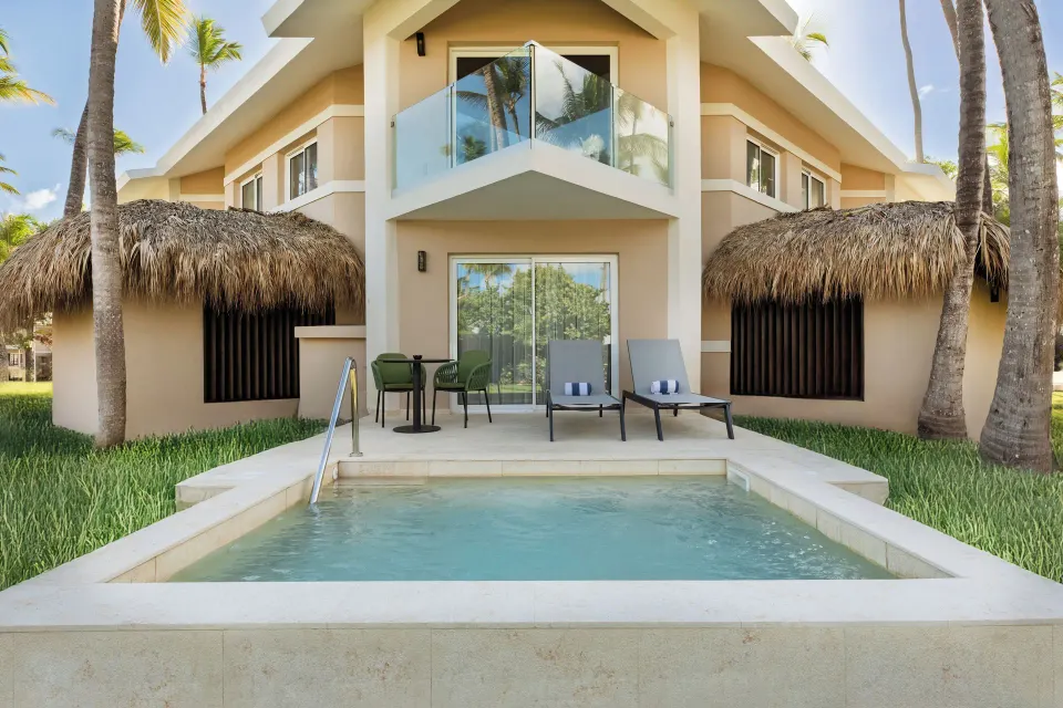 Superior Junior Suite private pool patio at Grand Palladium Select Bávaro with loungers and balcony.