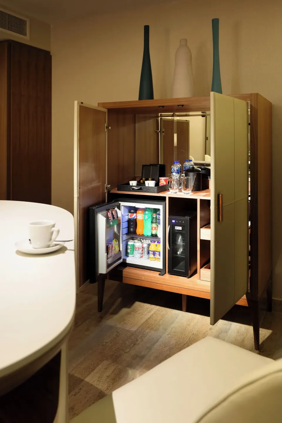 In-room minibar cabinet at Grand Palladium Select Costa Mujeres.