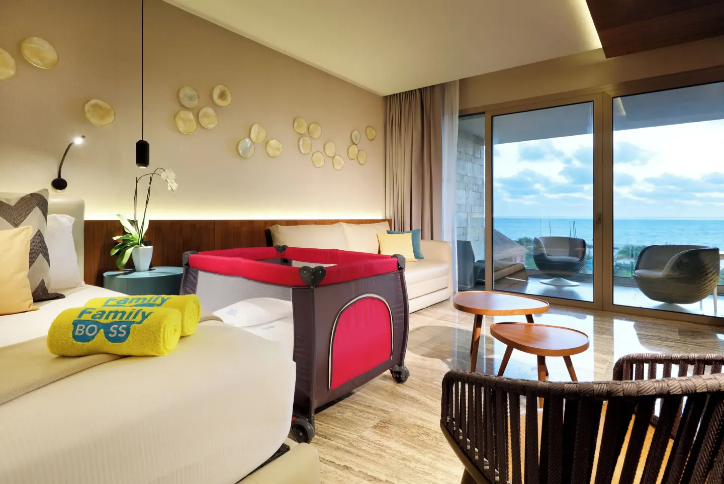 Ocean-view guest room with crib at Grand Palladium Select Costa Mujeres.
