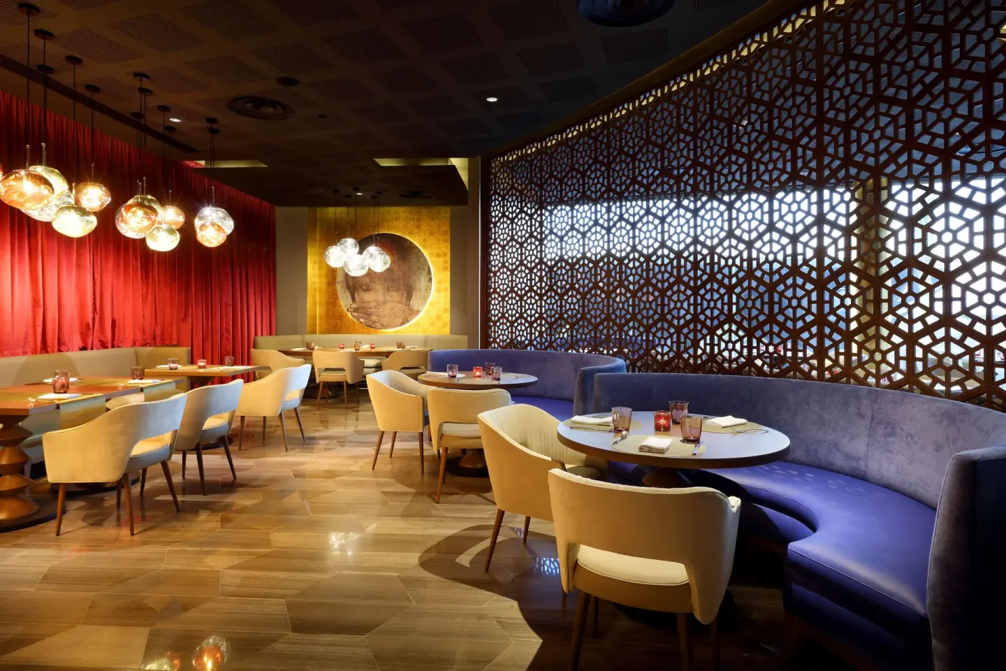 Curved dining booths and patterned screen at Grand Palladium Select Costa Mujeres.