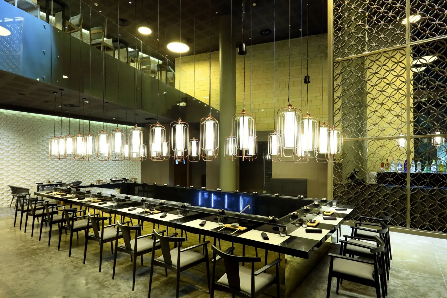 Japanese teppanyaki tables with hanging lanterns at Grand Palladium Select Costa Mujeres.
