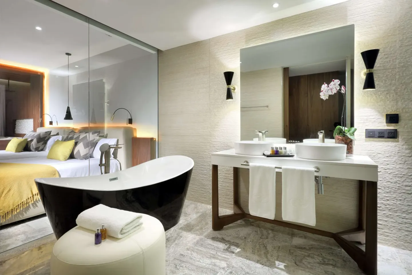 Junior Suite Pool Access bathroom and bedroom at Grand Palladium Select Costa Mujeres.