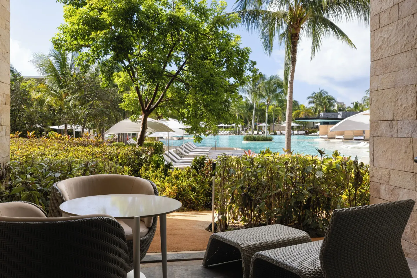 Junior Suite Pool Access terrace by the pool at Grand Palladium Select Costa Mujeres.