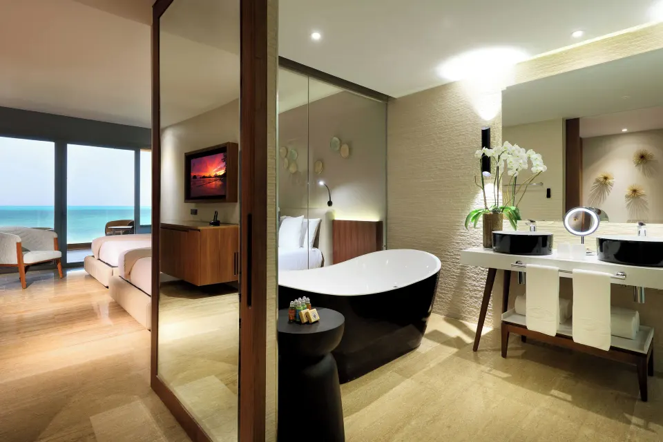 Loft Suite Jacuzzi Terrace bathroom and bedroom view at Grand Palladium Select Costa Mujeres.
