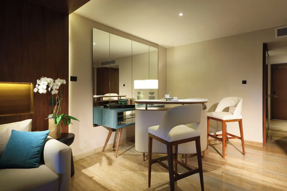 Loft Suite Jacuzzi Terrace sitting area with bar table at Grand Palladium Select Costa Mujeres.