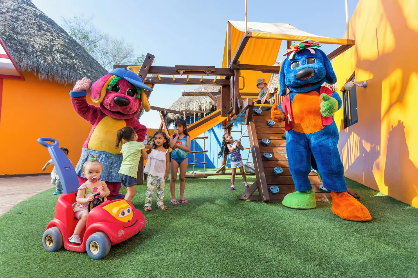 Children with colorful mascots in the playground at Grand Palladium Vallarta Resort & Spa.