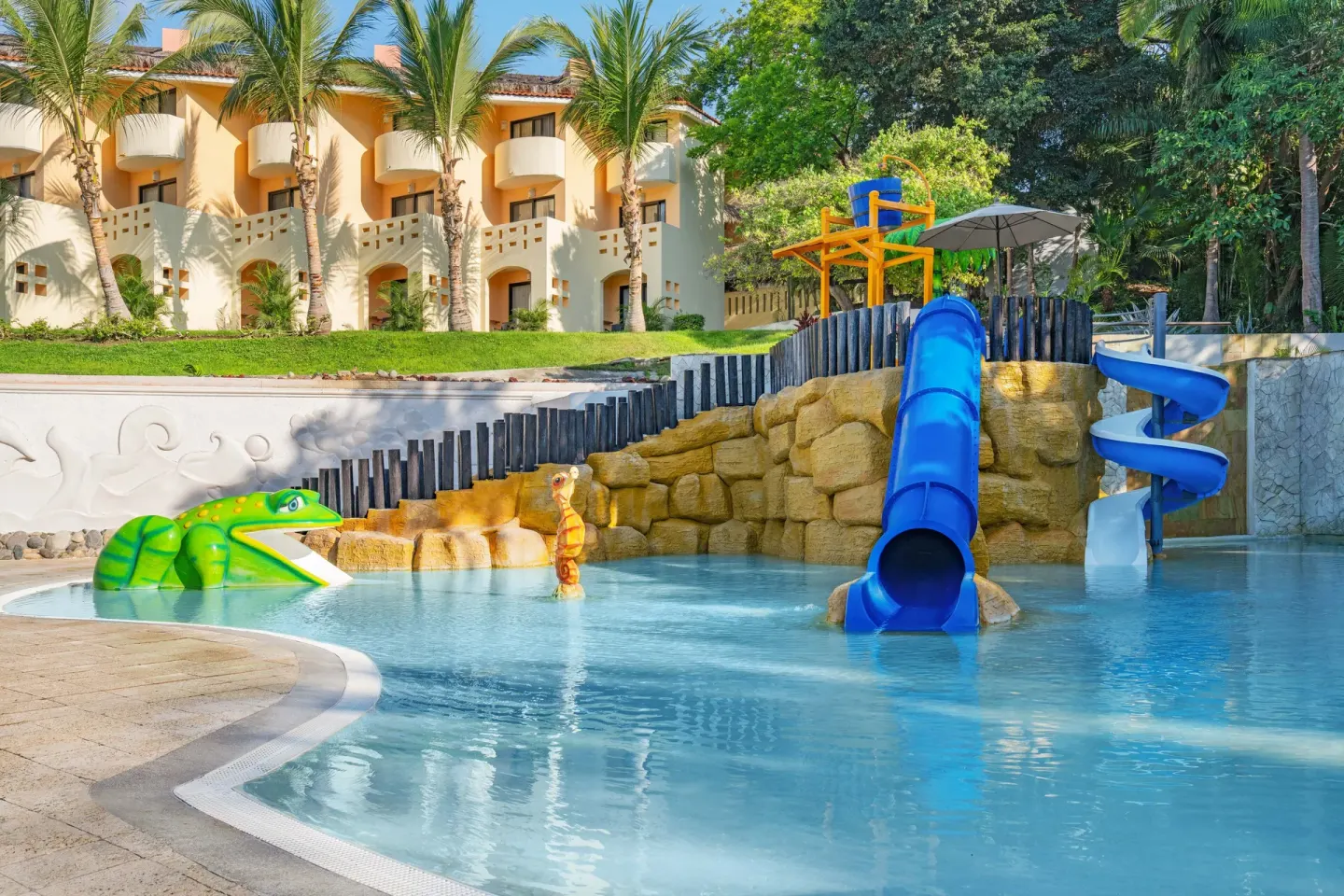 Children’s pool slides and animal figures at Grand Palladium Vallarta Resort & Spa.