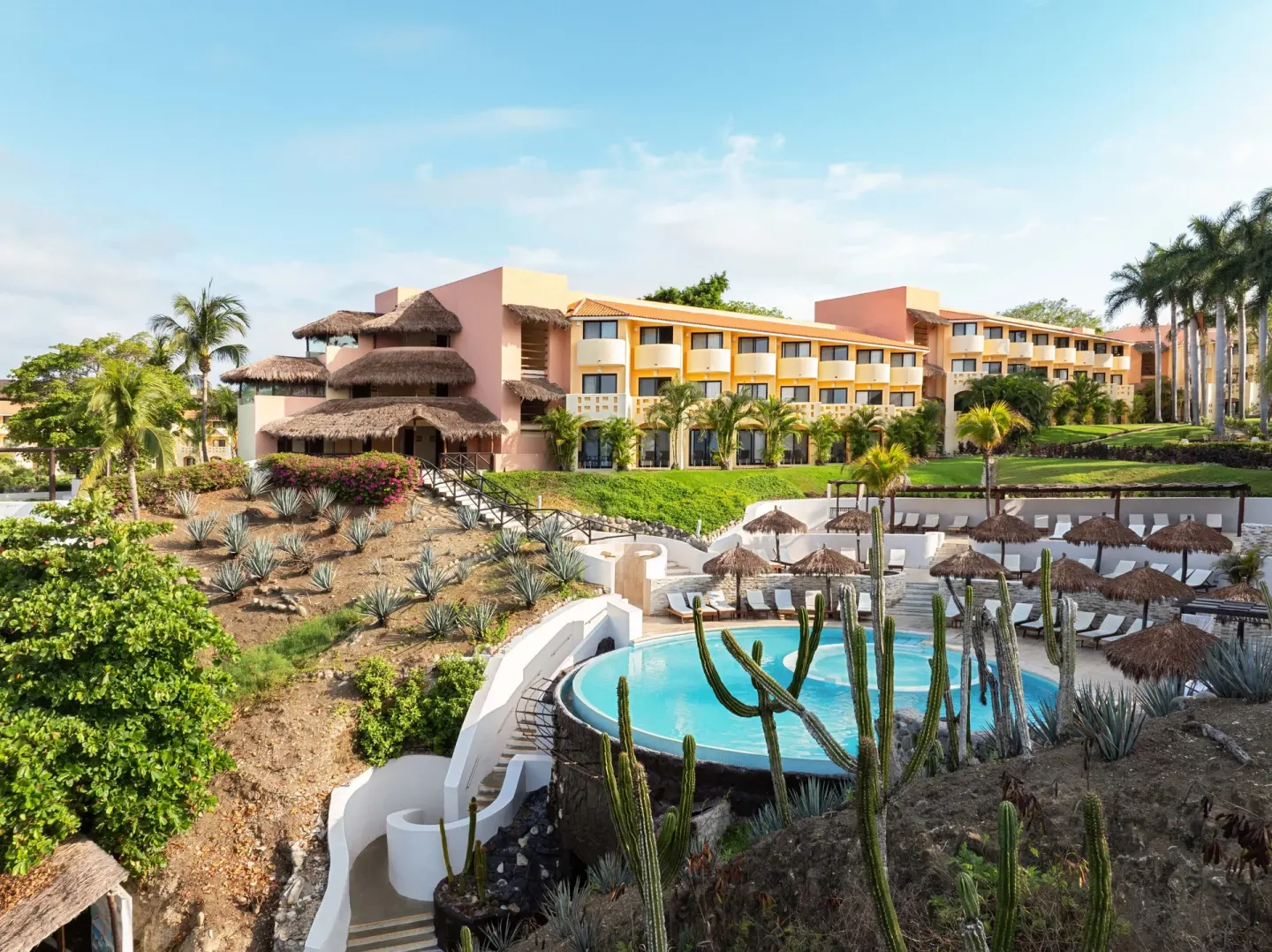 Hillside pool area with cactus landscaping at Grand Palladium Vallarta Resort & Spa.