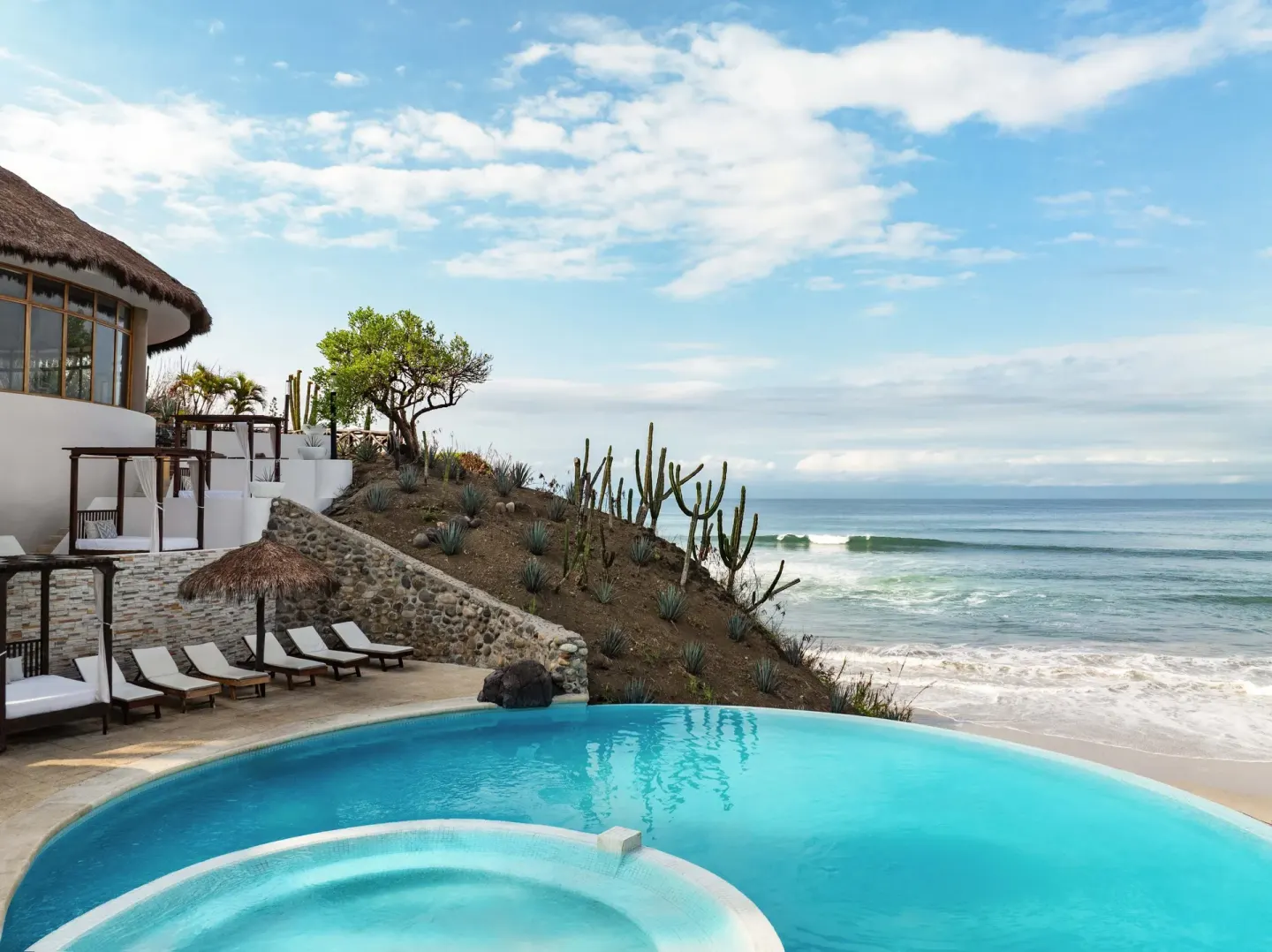 Pool edge overlooking the ocean at Grand Palladium Vallarta Resort & Spa.