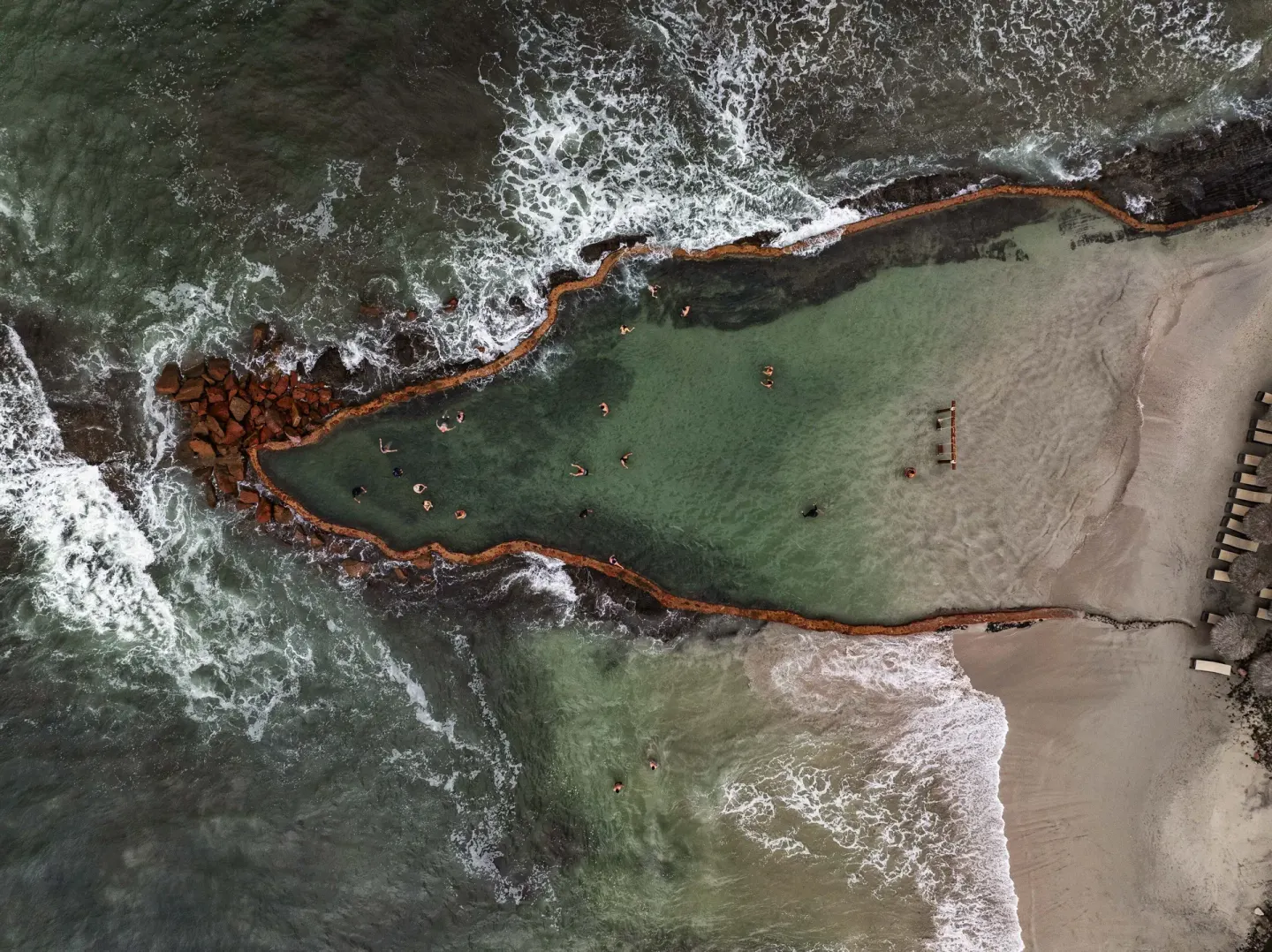 Aerial view of a rocky ocean swimming cove at Grand Palladium Vallarta Resort & Spa.