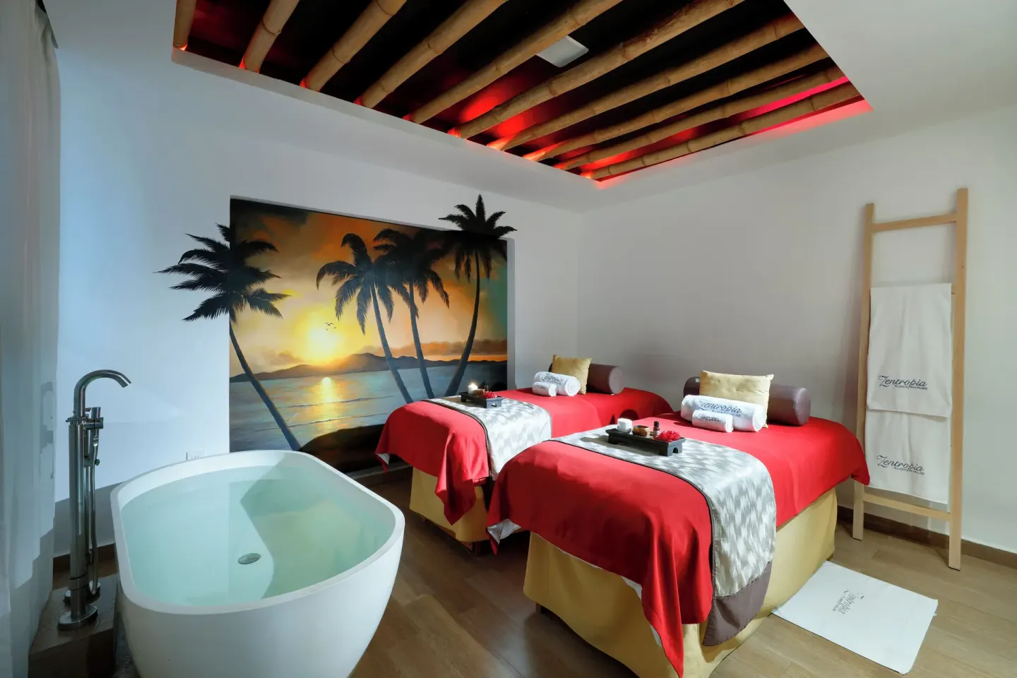 Spa treatment room with two massage tables and soaking tub at Grand Palladium Vallarta Resort & Spa.