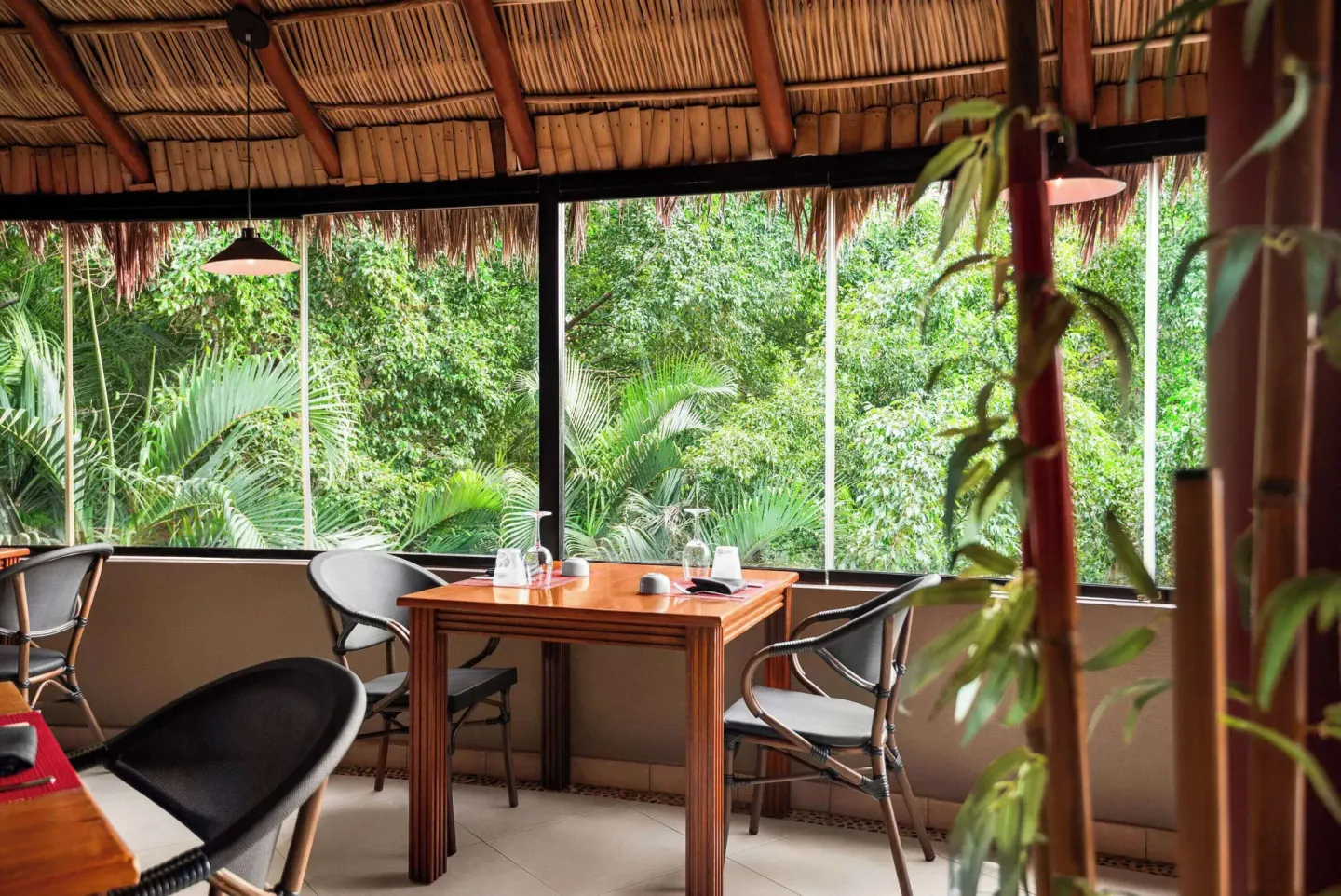 Asian-style dining table by jungle-facing windows at Grand Palladium Vallarta Resort & Spa.