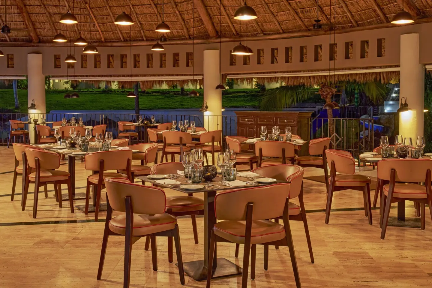 Thatched-roof restaurant dining room at Grand Palladium Vallarta Resort & Spa.