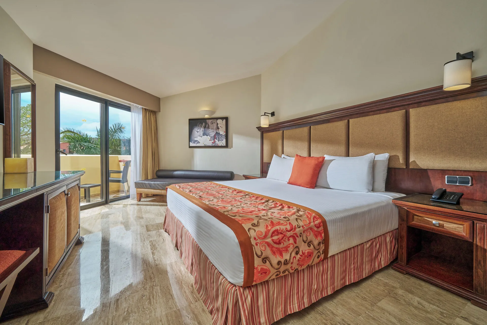 Deluxe Room at Grand Palladium Vallarta Resort and Spa with king bed, sofa seating, and contemporary design in Riviera Nayarit.