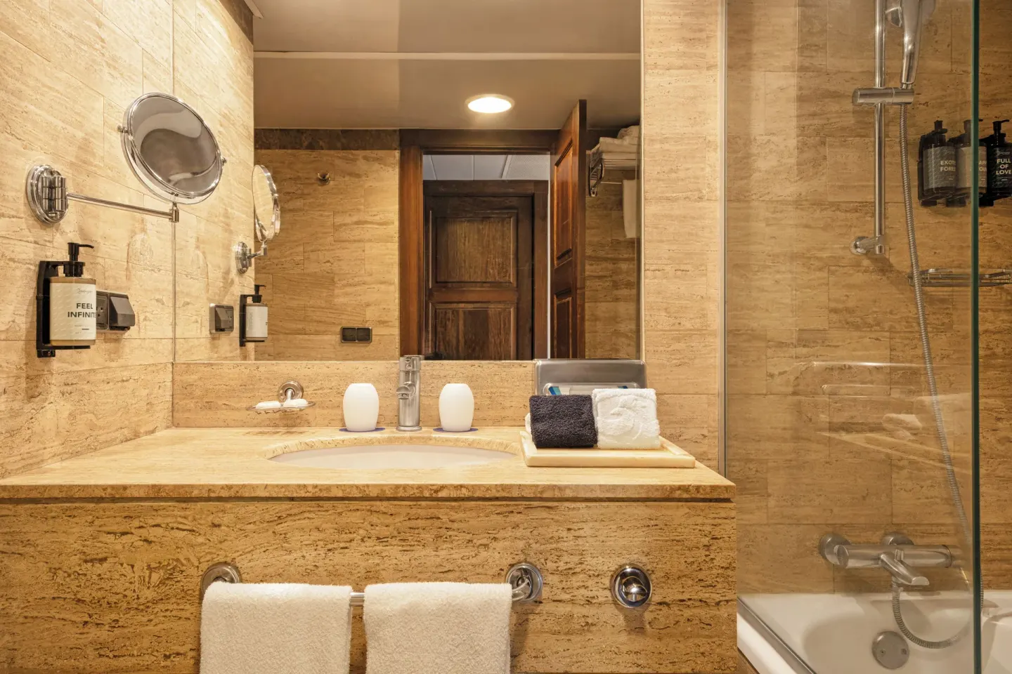 Deluxe Room bathroom with sink and tub shower at Grand Palladium Vallarta Resort & Spa.