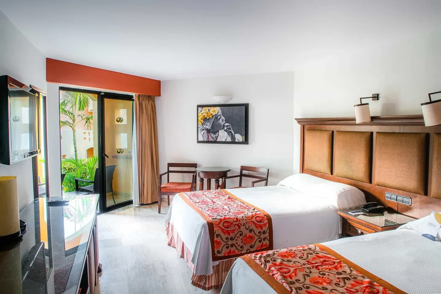 Deluxe Room with two beds and patio doors at Grand Palladium Vallarta Resort & Spa.