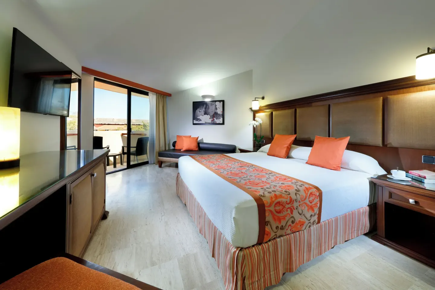 Deluxe Suite Ocean View room with king bed and sofa at Grand Palladium Vallarta Resort & Spa.