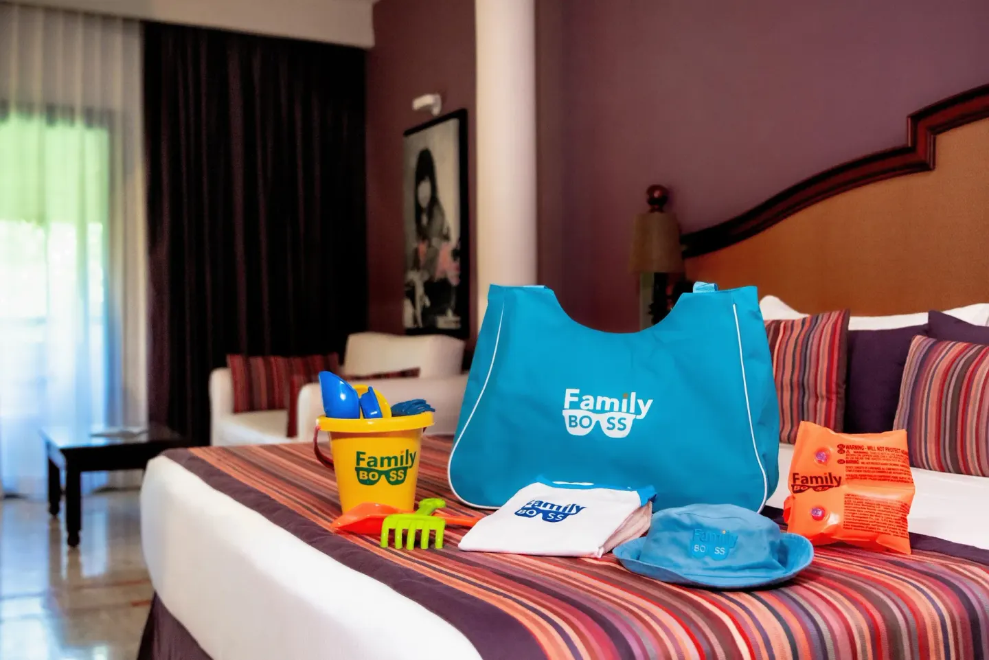 Family Selection Junior Suite bed with beach toys and tote at Grand Palladium Vallarta Resort & Spa.