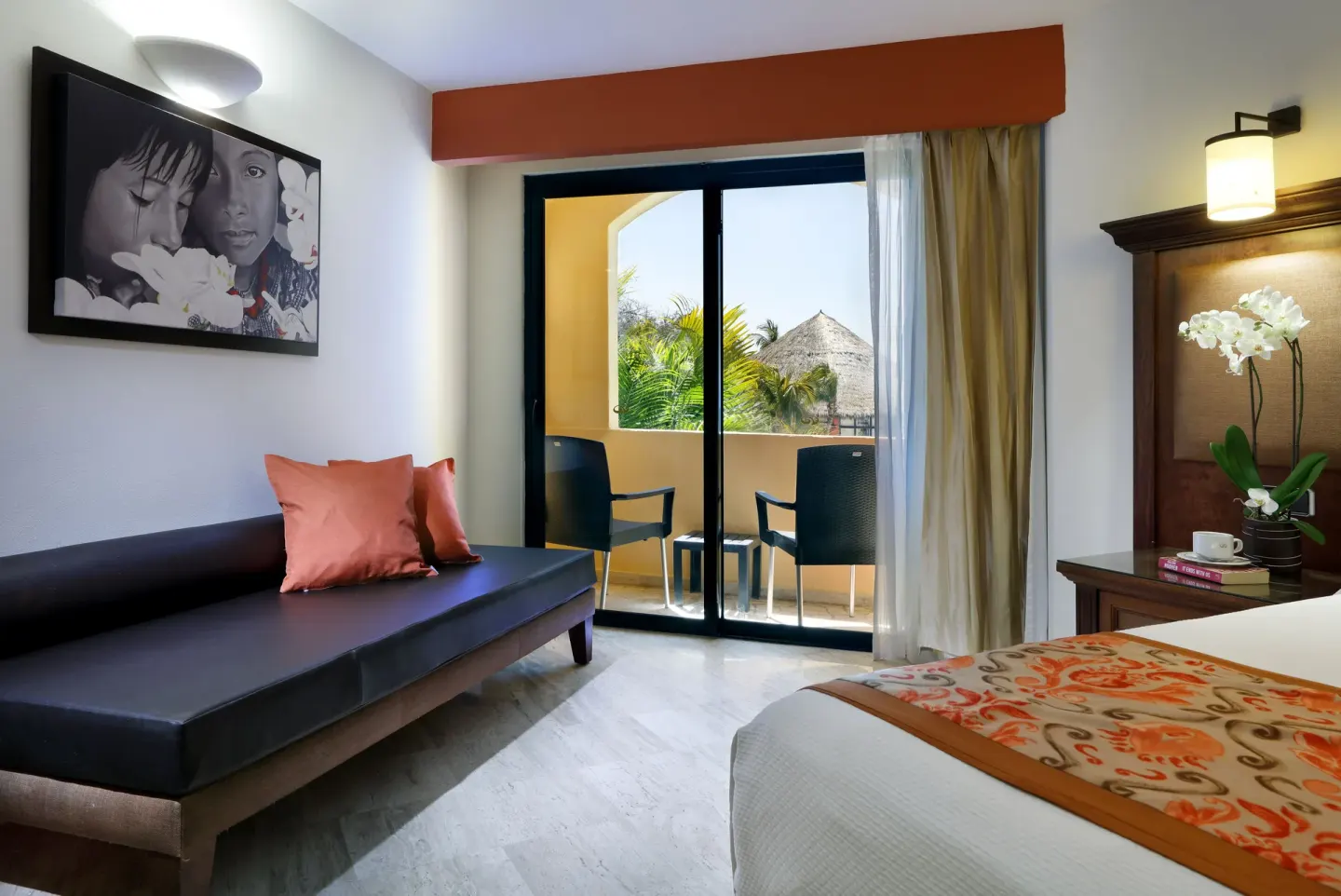 Panoramic Ocean View Suite sitting area and bed at Grand Palladium Vallarta Resort & Spa.