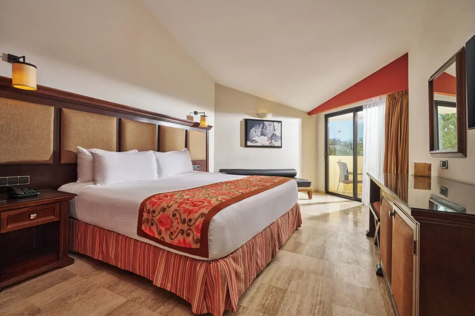 Suite Panoramic Ocean View king bed and balcony at Grand Palladium Vallarta Resort & Spa.