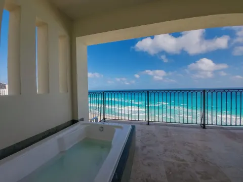 Balcony bathtub overlooking the Caribbean Sea at Grand Park Royal Cancun.