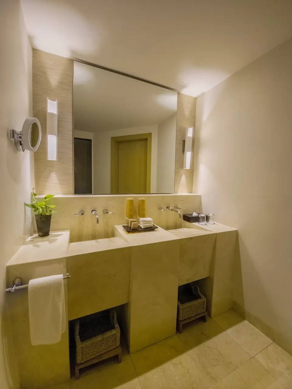 Bathroom vanity with double sinks and large mirror at Grand Park Royal Cancun.