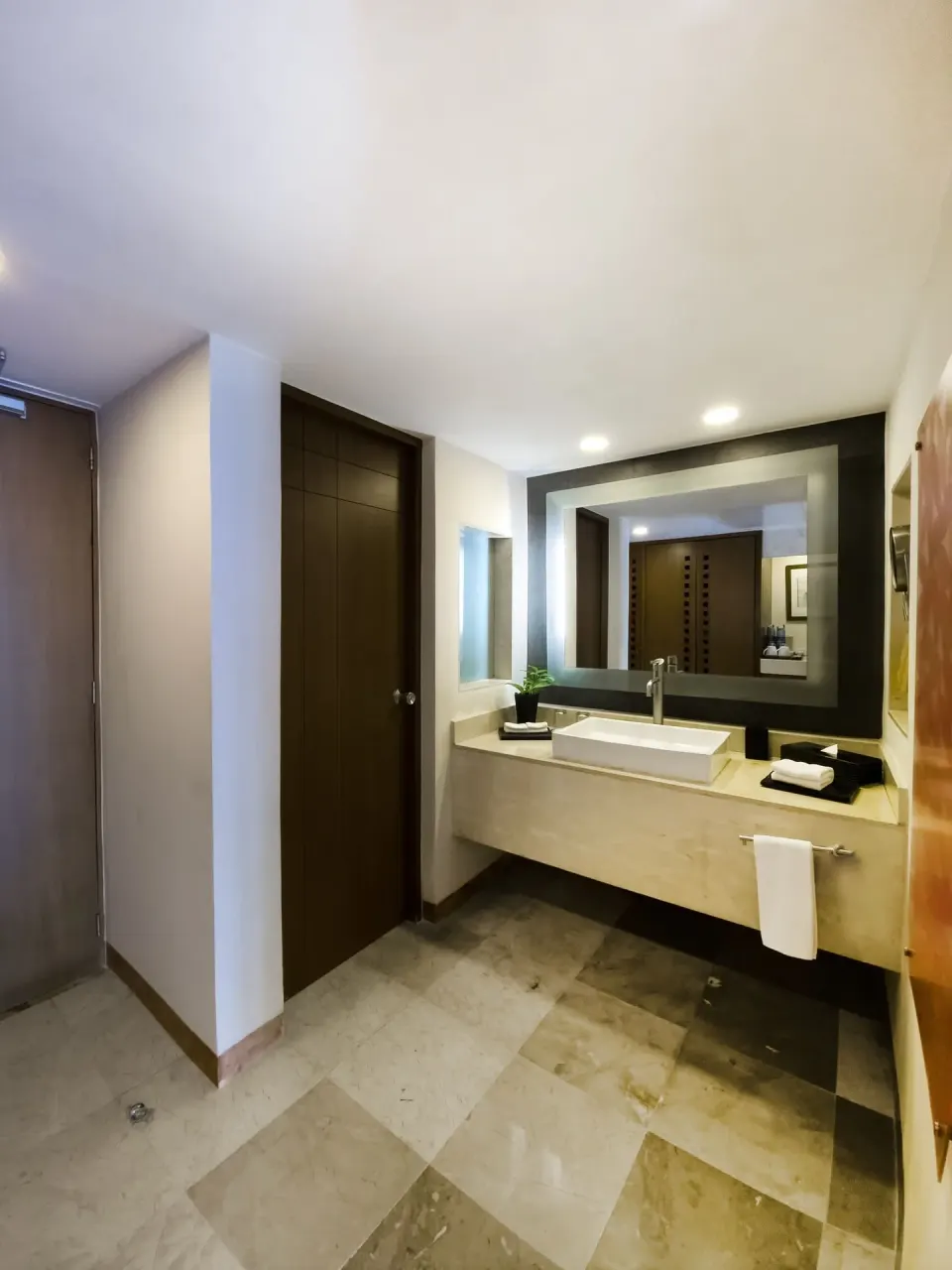 Deluxe Ocean View bathroom with vanity and mirror at Grand Park Royal Cancun.