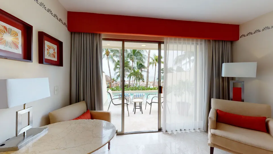Deluxe Swim Up sitting area with patio and pool access at Grand Park Royal Cancun.