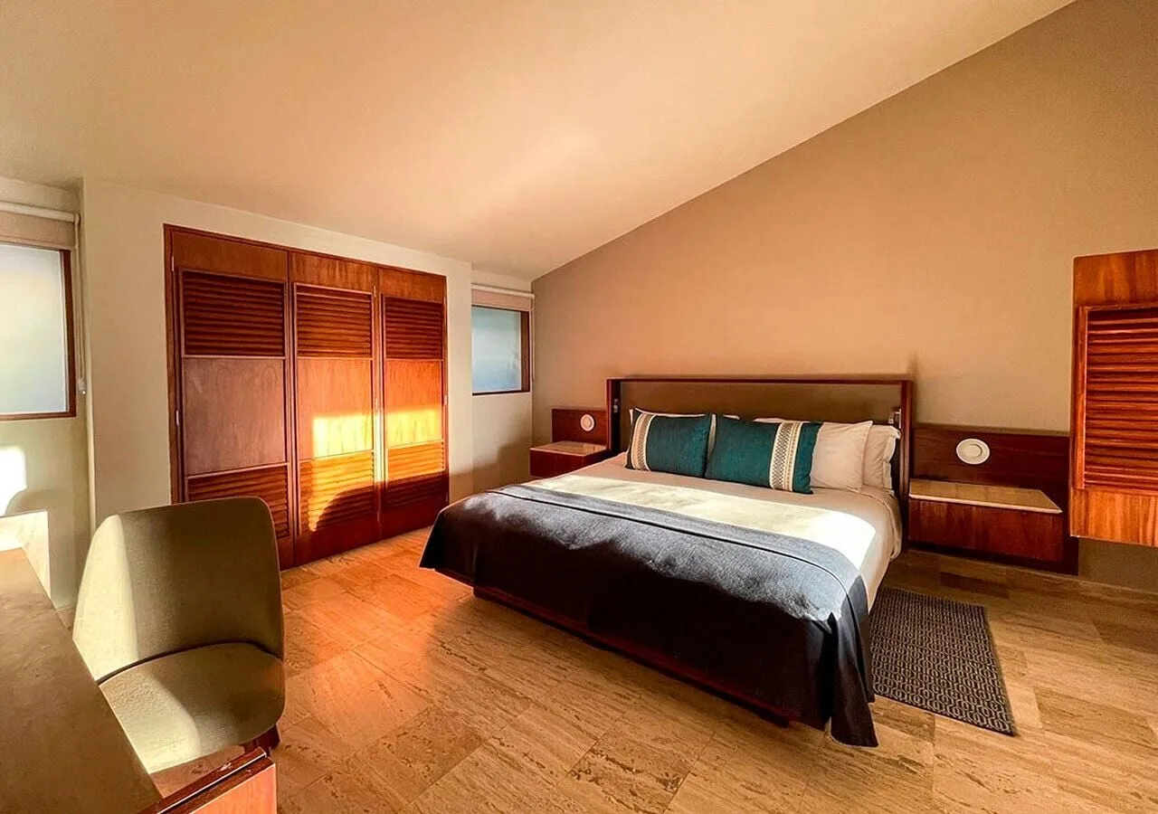 Bedroom with a king bed in the Grand Villa Master Suite at Grand Park Royal Cancun.