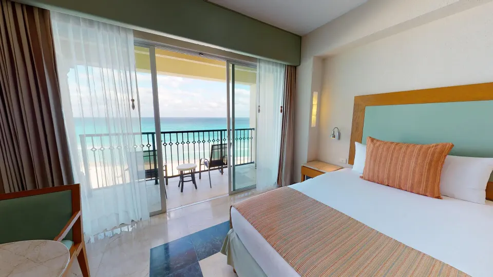 Premier Ocean Front Doble bed and oceanfront balcony at Grand Park Royal Cancun.